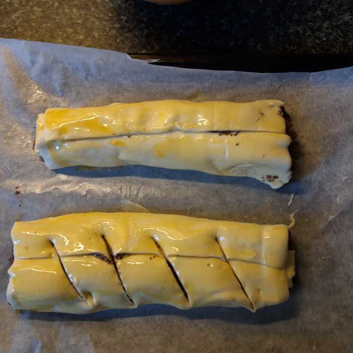 Make shallow cuts on top surface and paint with egg yolk