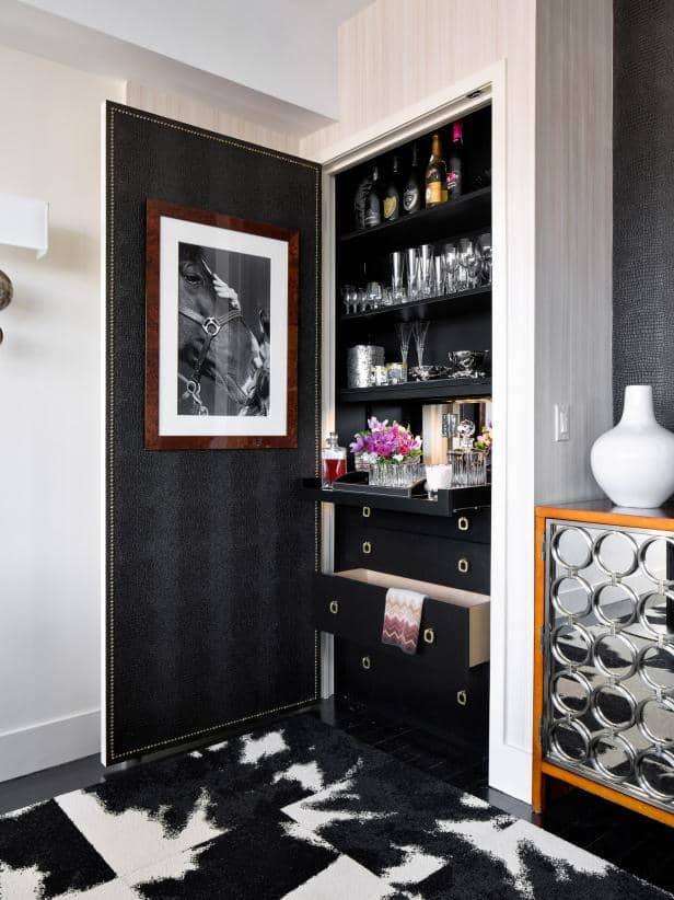 Your bar can take many forms, from a dedicated built-in area, to a converted closet-turned-bar, to a standalone bar cabinet.
