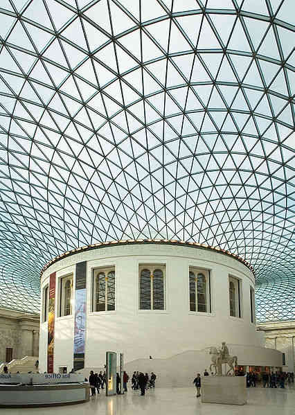 The Great Court of the British Museum, with the tessellated roof designed by Foster and Partners arching around the original, circular, Reading Room of the British Library.