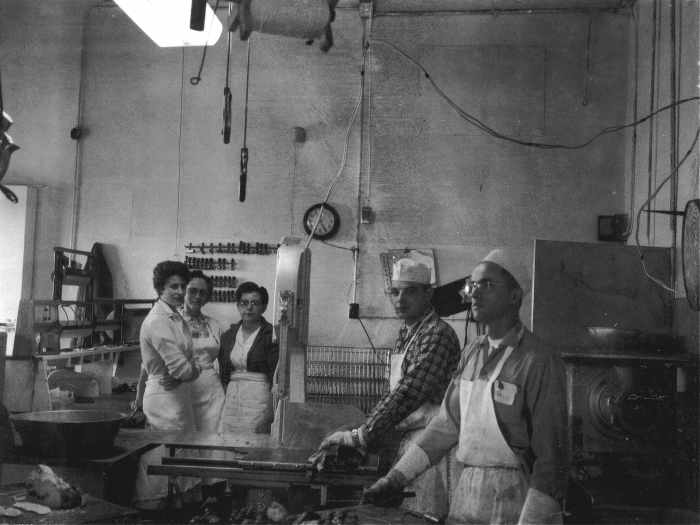 L to R: Mom, an employee, my Grandmother, Dad, another employee. The meat grinder is farthest to the right.