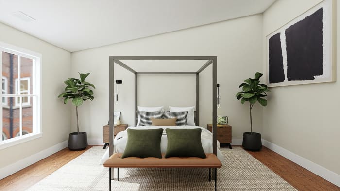 Notice the olive green, sandy and black and white pillows, along with vibrant green plants, tied together with neutral bedding and a similar neutral colored, TEXTURED rug