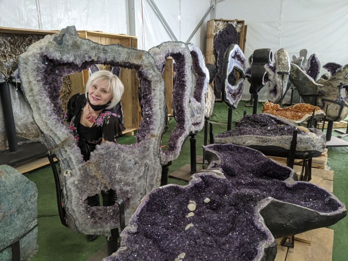 My wife posing in the midst of large geodes at the Tucson Gem and Mineral Show