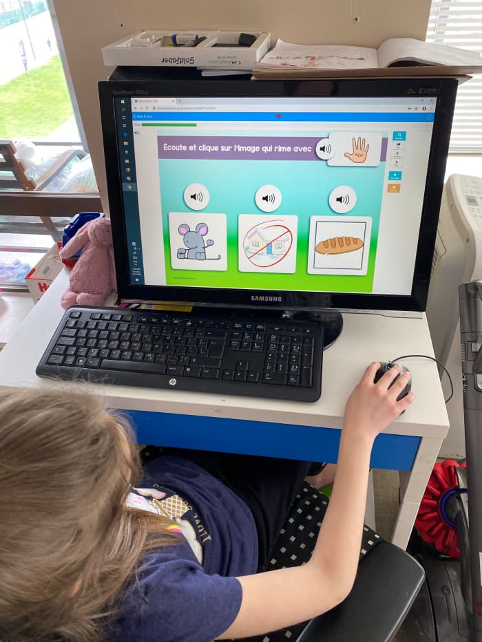 My daughter using an online reading and listening audio program. The images are user friendly and the icons are large and easier to click on.
