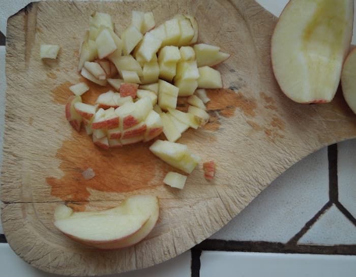 I slice each quarter lengthwise into about six pieces. Then I make stacks of about 3 or 4 slices, slice each stack across in half lengthwise, and then chop the stack across several times to get the small pieces.