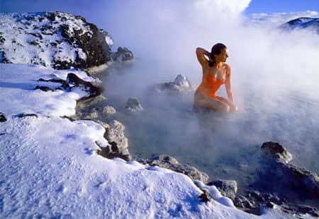one of Iceland's hot springs where the water stays at 100 degrees year round, regardless of snow on the ground