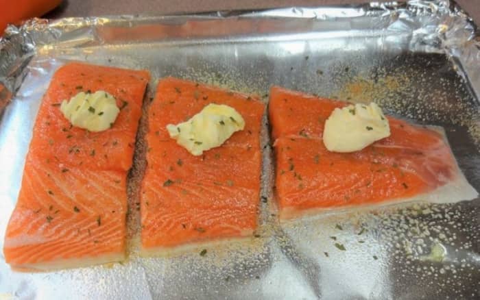 Cut the fillet with scissors and place skin-side down on a cookie sheet covered with foil.