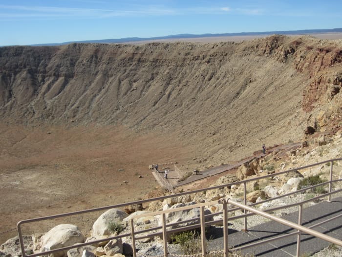 Looking down from the top of the observation deck at my wife (white jacket in the middle of lower platform) on the platform just above the floor of the crater.