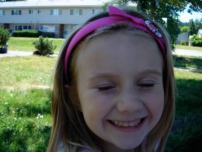 Emma, in front of our house on Fort Lewis. This was taken not long after her recovery.