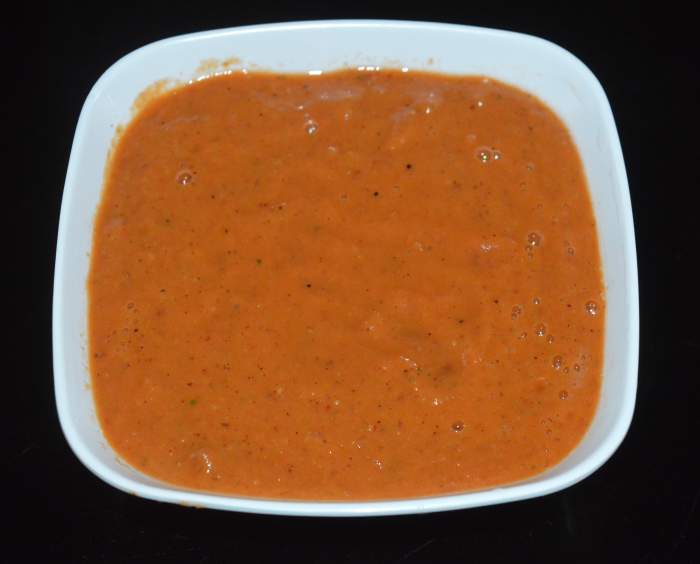 Step four: Add the mixture to a mixer. Grind to get a smooth sauce. Transfer it to a bowl. 