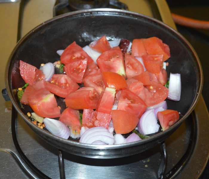 Throw in the tomatoes. 