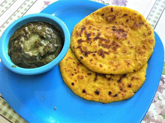 Maize flour flatbread served with sarson ka saag (mustard greens curry)
