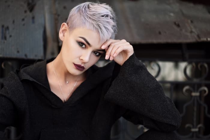 Platinum blonde hair intentionally over-toned using a pearl blonde shade for a sleek, violet-silver look.