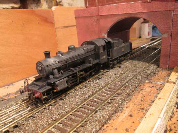 Ivatt 2 MT 2-6-0 46480 exits Unit 1 fiddleyard light engine on the Down Main. She'll gain the Up Main at the junction, by the signal cabin