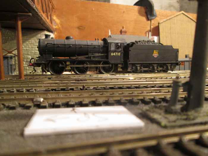 J39 64710 almost hides the signal cabin here. The signalman has to be able to see under the bridge to the signals down the bank to beyond the curve where more signals will be before the skew brifge