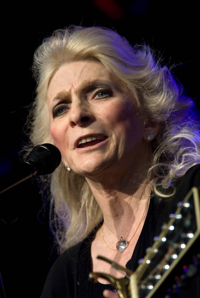 Judy Collins, a famous folk artist known throughout the world performing in concert.