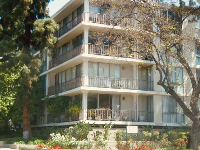 Imagine how gorgeous this apartment building in Southern California would look with flowers cascading from each balcony like colorful waterfalls. The flowers could attract passersby, while still screening people sitting on the balcony.