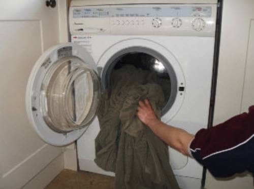 Check the slipcover care tag to make sure you can throw it in the washing machine or hand wash it in the tub.