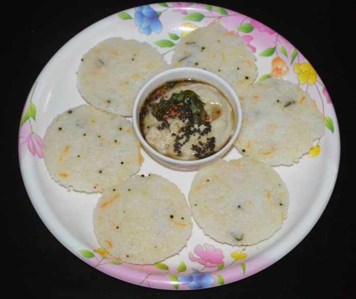 Step five: When they are not so hot, remove the idlis from the idli maker. Serve hot idlis for breakfast with coconut chutney or any other chutney or sambar. Enjoy the taste. They make a delightful breakfast!