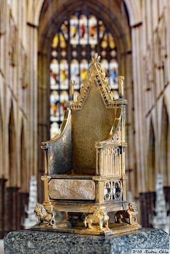 A silver gilt model of the coronation chair made to commemorate Queen Elizabeth II’s silver jubilee.