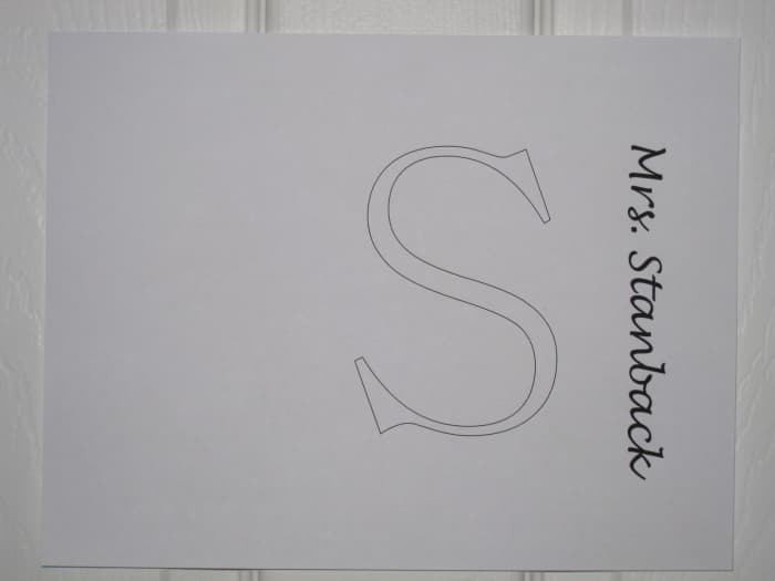 This is what the template will look like when printed out (name and initial may be different, unless your child is in my child's class). I know it's not centered, but when trimmed to 8"x8" it is.
