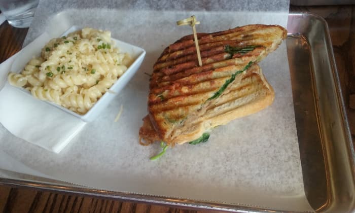 Served on a waxed paper lined metal tray for restaurant customers who dine-in at the restaurant, the duck club sandwich is one of my favorite food items to order from Melt Kitchen & Bar restaurant. A tasty pasta salad accompanies the duck sandwich.