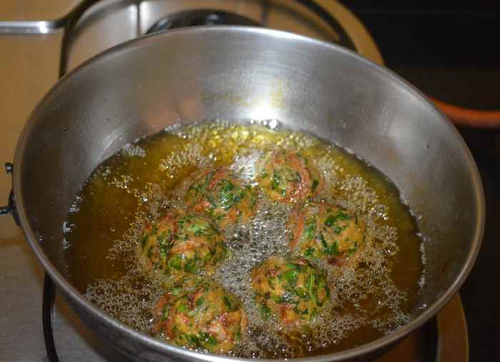 Fry the balls until they become golden brown and crunchy. 