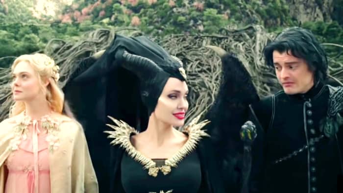 Maleficent, her crow who was in the form of a human, and princess Aurora.They get ready in the forest to go to dinner.