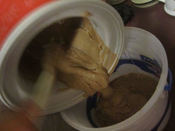 Step 8: Using a plastic spatula so you don't scratch the interior of the freezer bowl, scoop the gelato into some other container for chilling.
