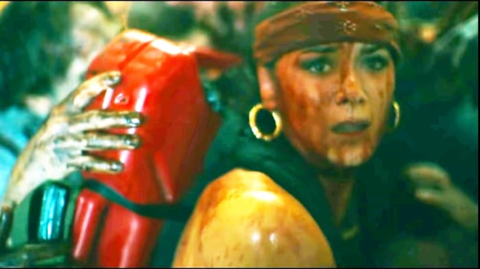 Those zombies hold that girl. That girl fights with them but those zombies were so strong how can she defeat them.