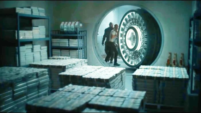 Scott orders his team that we have a shot time. They immediately open that locker and hurriedly shift the money in their bags.