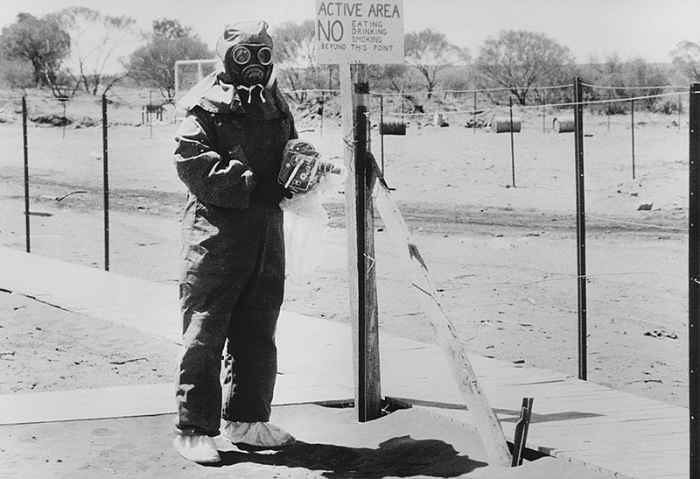 Taken in 1950, this photo shows a man called John L. Stanier in protective clothing at the Maralinga test area.