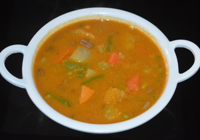 Udupi-style vegetable kootu is ready! Add tempering as per instructions. Mix well.