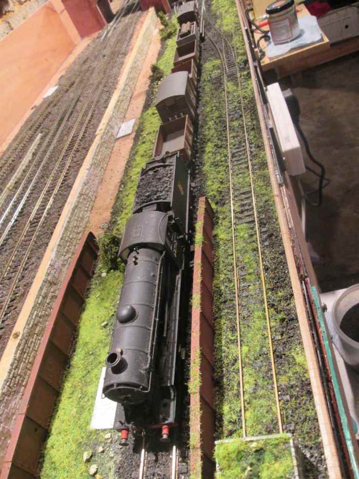 J39 64710 heads local pick-up goods to the junction. Ballasted, with scatter fixed down, drainage channelling needs to be sourced and laid down, as well as signal posts (one on what was the Down Freight/Goods/Mineral to be minus its 'home' arm.