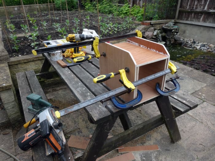 All four pieces glued and clamped together, and ready for screwing; with the sacrificial spacers in place to temporarily support the top at the correct height during assembly.