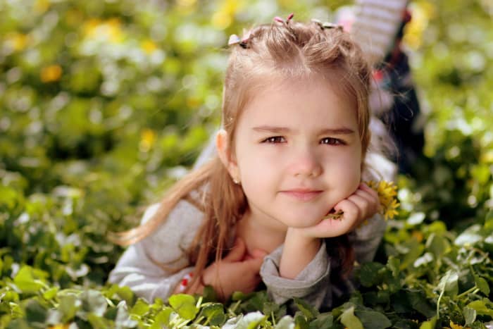 Have a person look at the camera with the sun behind them. Then they are not squinting from the sun. Then turn on the flash to give a sparkle to the eyes. You may also need to increase the exposure too by +1 or more.