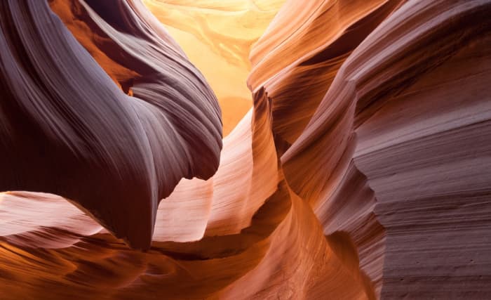 Using a wide angle lens and a small aperture of f/11 or more and most of the image will be in focus. Ideal for photographing landscapes.