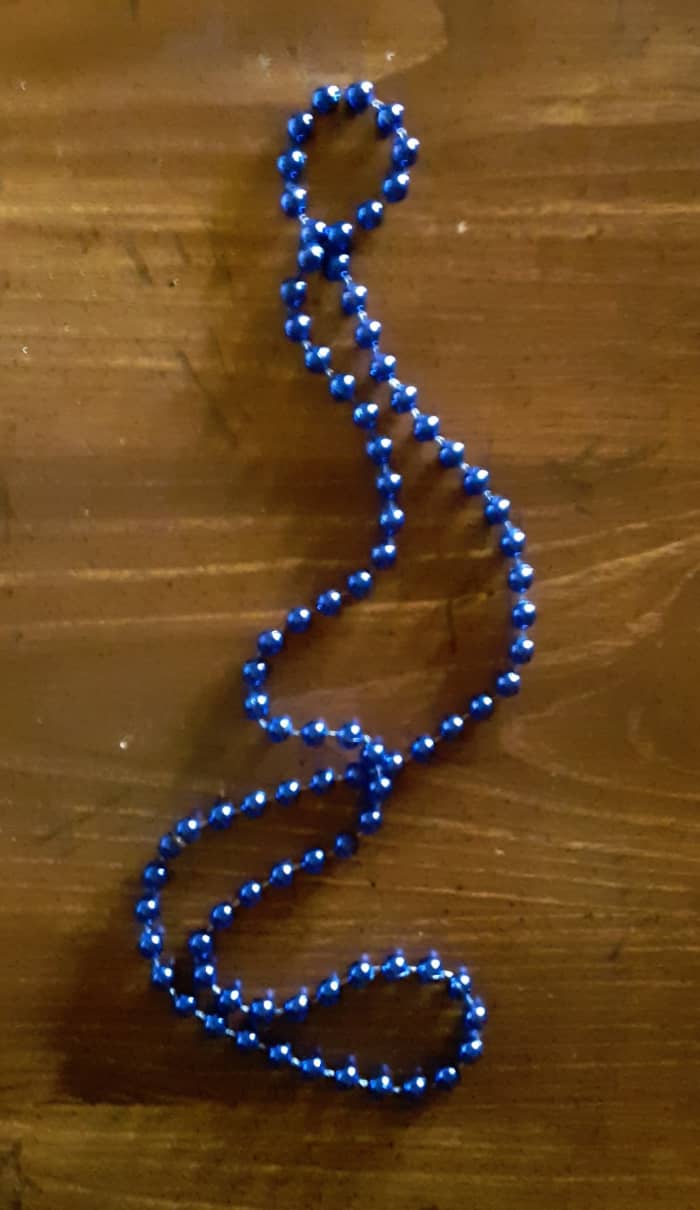 Party beads make the perfect mermaid tears. I chose blues and greens for this craft. The glitters may be any color.. I picked white, blue, and green glitter.