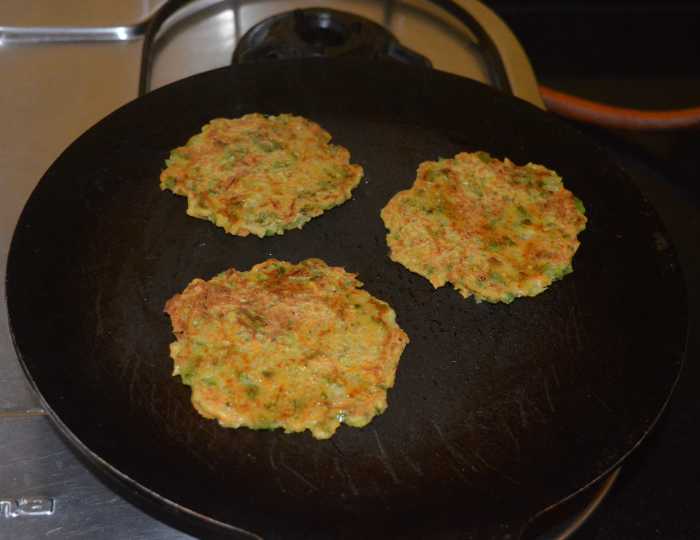 Add a few drops of oil to the top. When both the sides become golden brown, remove them on a serving plate.