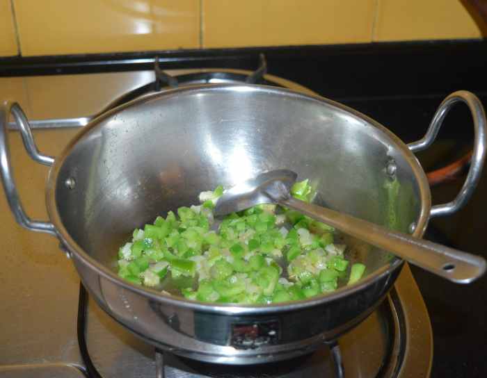 Throw in chopped capsicum. Mix well.