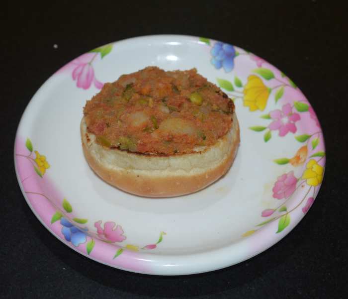 Place a thick layer of the stuffing on the toasted bottom bun slice.  