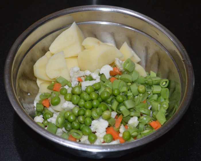 Step one: Cook the veggies in a pressure cooker as per instructions. Turn off the heat.