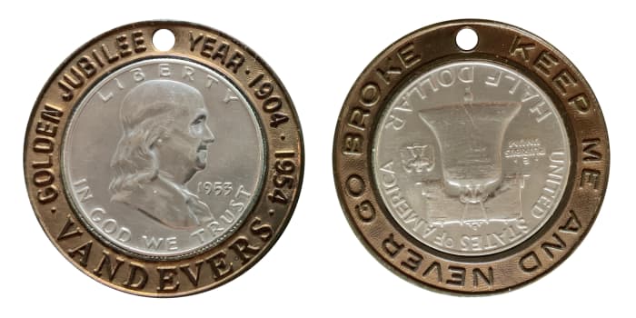 A 1953-D Franklin half dollar in a brass encasement. Observe legend: Golden Jubilee Year - 1904 -1954. Vandevers. Reverse: Keep Me and Never Go Broke. Value $75 to $90.