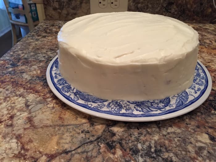 Smoothed icing can be left as it is, or be decorated with chopped pecans either on top, on the sides, or both.