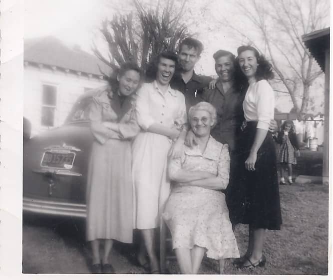 My Mother's mother and family in the 50's. My mother is on the left of my grandmother. My grandmother is sitting in front.... Phyllis (the one burned badly) is located to far left, looking down.