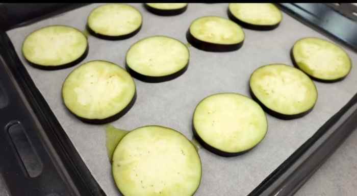 Step 4: Place sliced eggplant evenly on the pan.