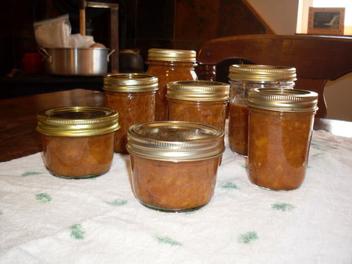 ...remove jars to a towel away from drafts, and let sit overnight. The jars often "pop" or "ping" as they cool and seal. Refrigerate or re-process any unsealed jars.