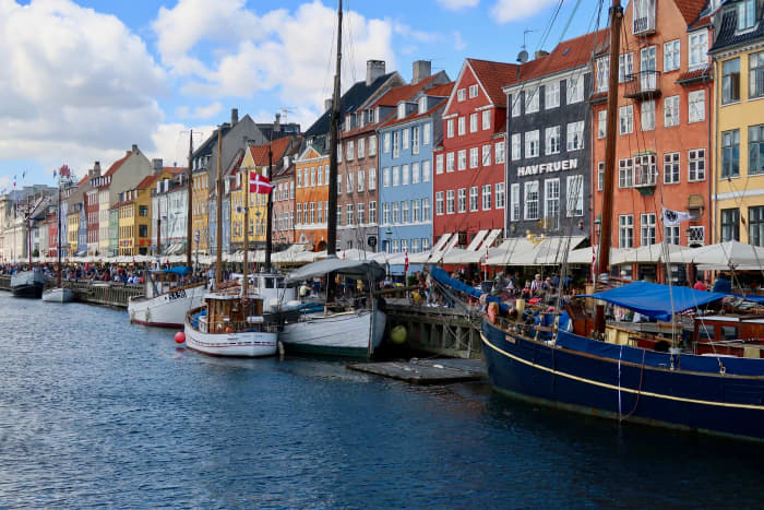 View of Nyhavn one of the must visit places in Copenhagen and from where you can take a boat trip round the city.