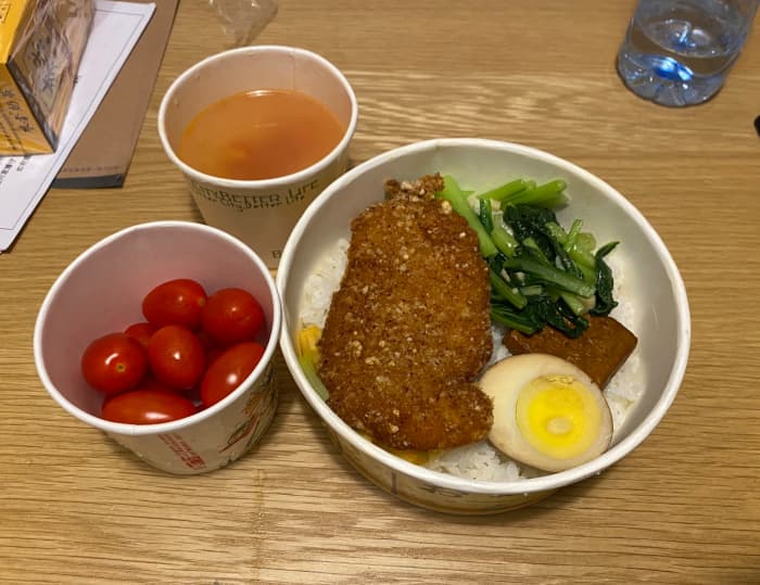 What a typical dinner looks like for us. The hotel makes the food for us and delivers it in takeout bento boxes.