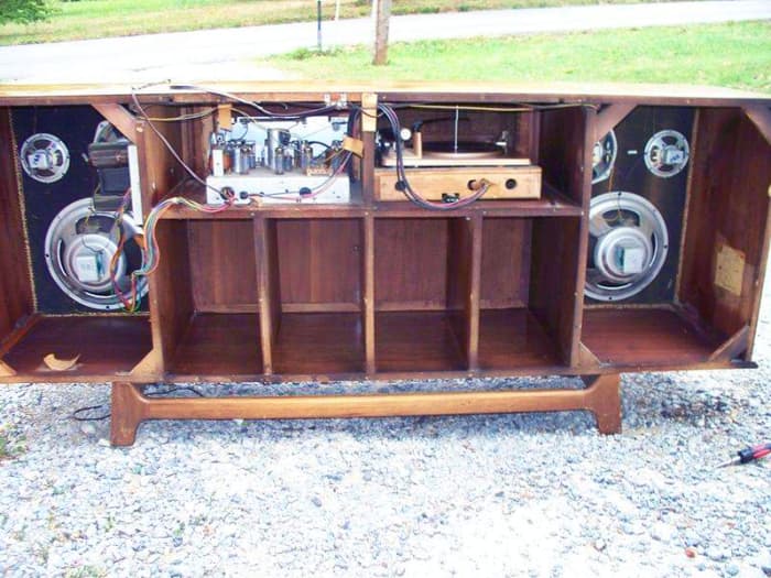 Solid wood construction, Pecan hand rubbed finish, and look Inside the cabinet of the Royal Dane, all that storage for LPs and other records.