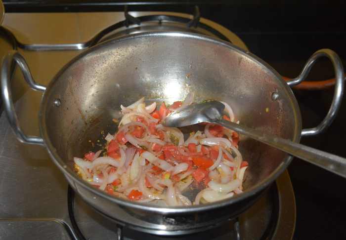 Saute the mixture until the tomatoes become soft.